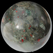 African Bloodstone sphere 84mm 831g in sunlight - Rocks and Things Store