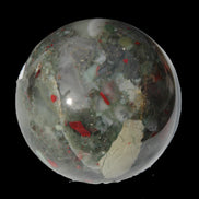 African Bloodstone sphere 84mm 831g in sunlight - Rocks and Things Store