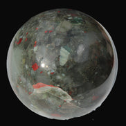 African Bloodstone sphere 84mm 831g in sunlight - Rocks and Things Store