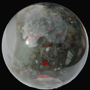 African Bloodstone sphere 84mm 831g in sunlight - Rocks and Things Store