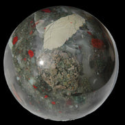 African Bloodstone sphere 84mm 831g in sunlight - Rocks and Things Store