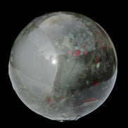 African Bloodstone sphere 84mm 831g in sunlight - Rocks and Things Store