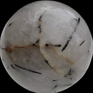 Tourmaline in Quartz sphere 86mm 894g in sunlight - Rocks and Things Store