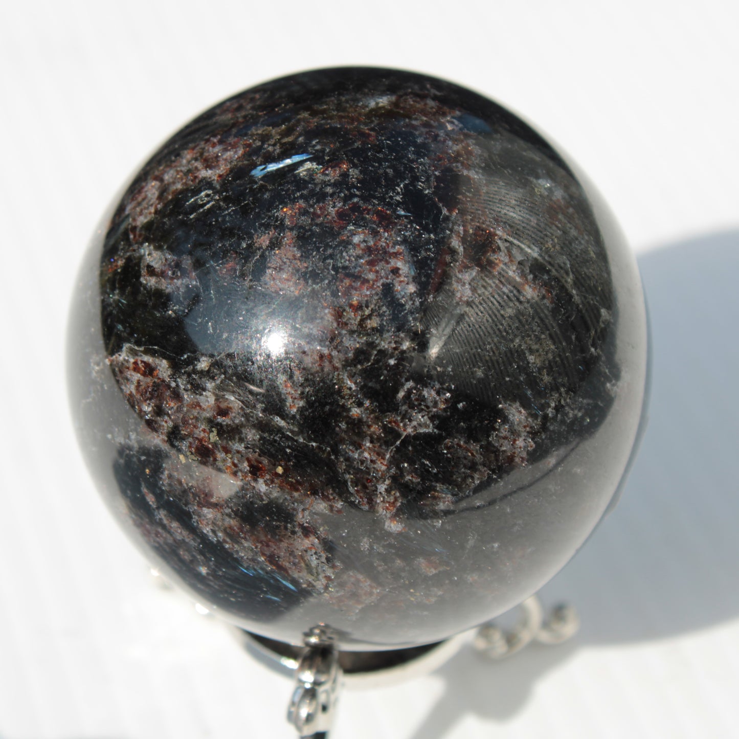 Astrophyllite Garnet sphere 61mm 367g Rocks and Things