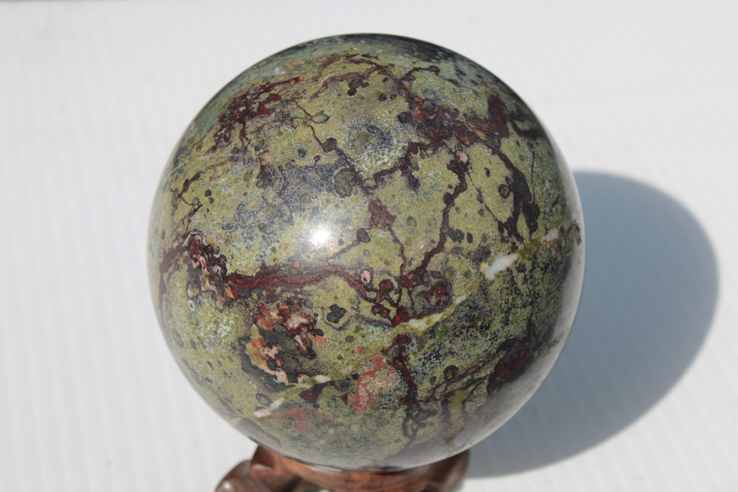 Dragons Blood Stone sphere 83mm 928g Rocks and Things