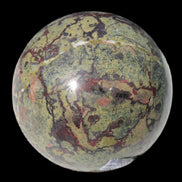 Dragons Blood Stone sphere 83mm 928g in sunlight - Rocks and Things Store