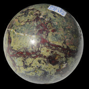 Dragons Blood Stone sphere 83mm 928g in sunlight - Rocks and Things Store