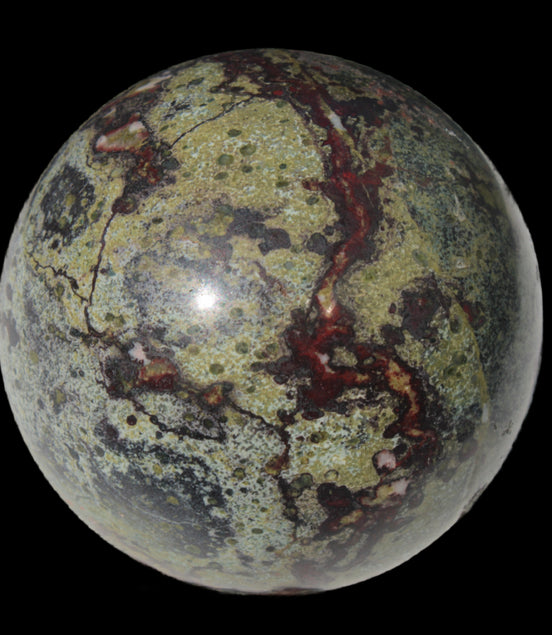 Dragons Blood Stone sphere 83mm 928g in sunlight - Rocks and Things Store