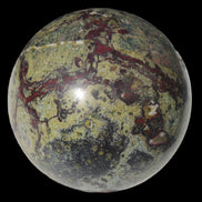 Dragons Blood Stone sphere 83mm 928g in sunlight - Rocks and Things Store