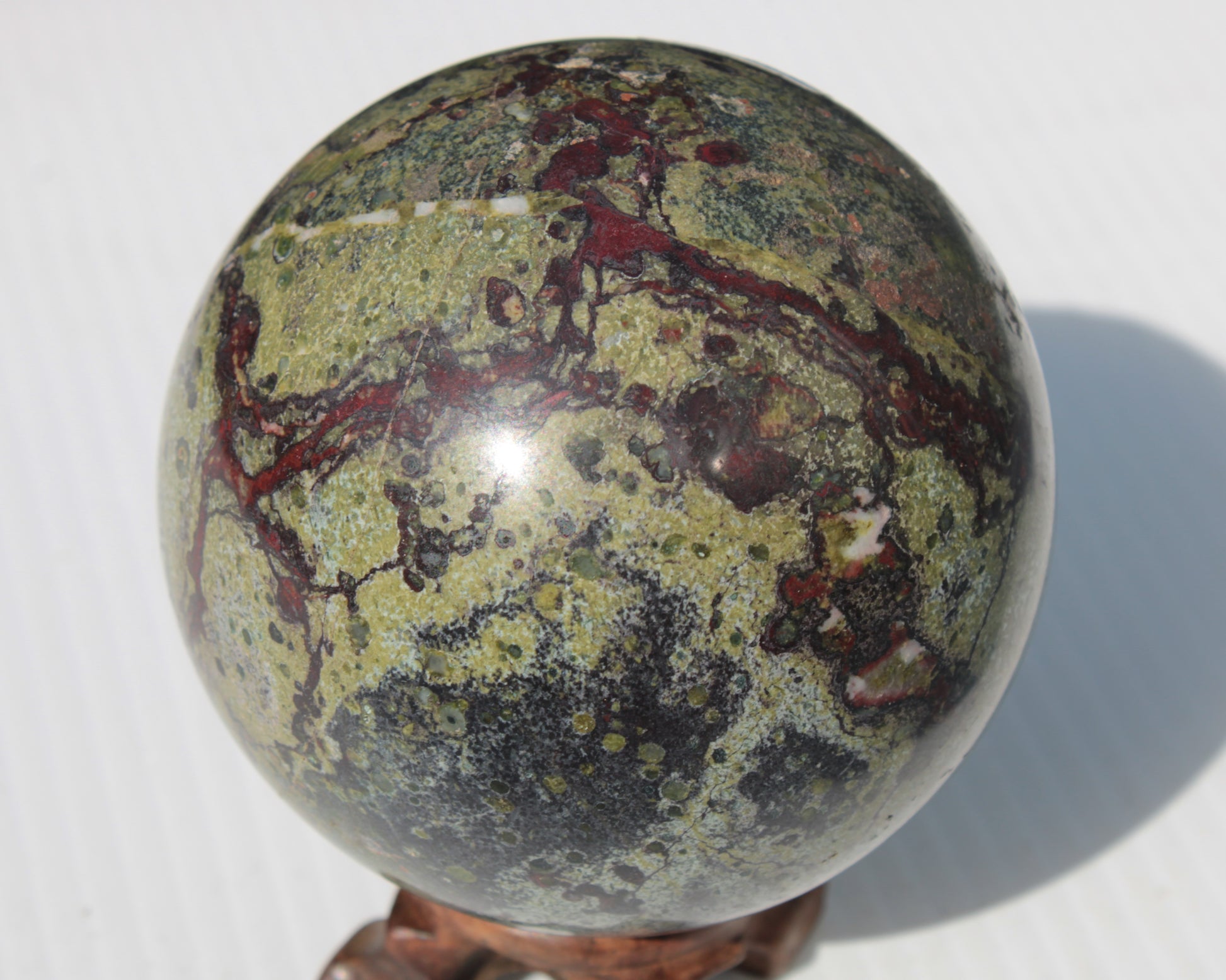 Dragons Blood Stone sphere 83mm 928g Rocks and Things