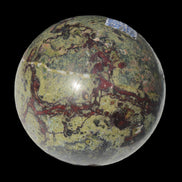 Dragons Blood Stone sphere 83mm 928g in sunlight - Rocks and Things Store