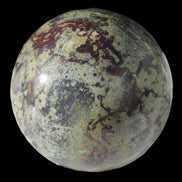 Dragons Blood Stone sphere 83mm 928g in sunlight - Rocks and Things Store
