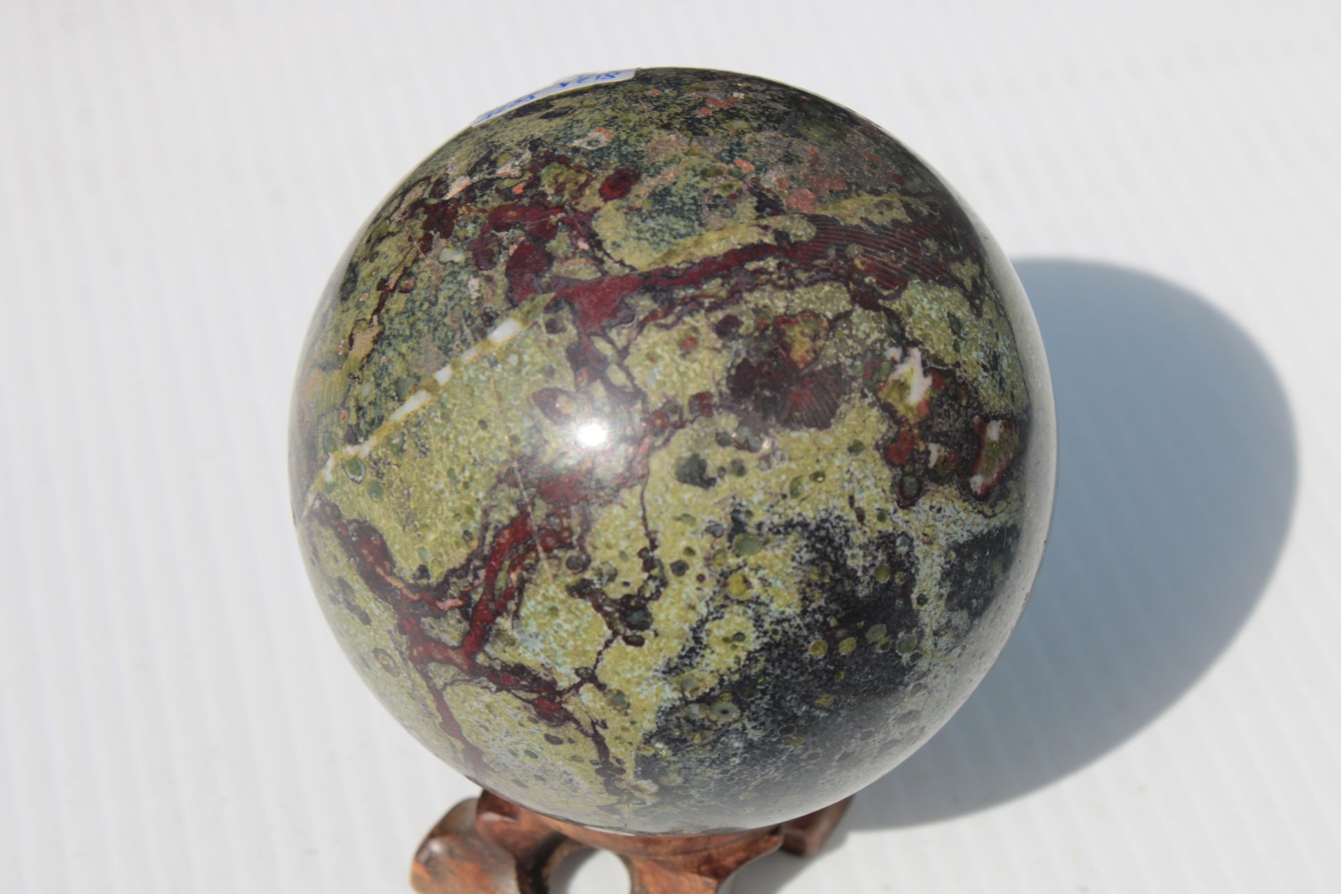 Dragons Blood Stone sphere 83mm 928g Rocks and Things