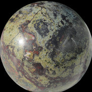 Dragons Blood Stone sphere 83mm 928g in sunlight - Rocks and Things Store