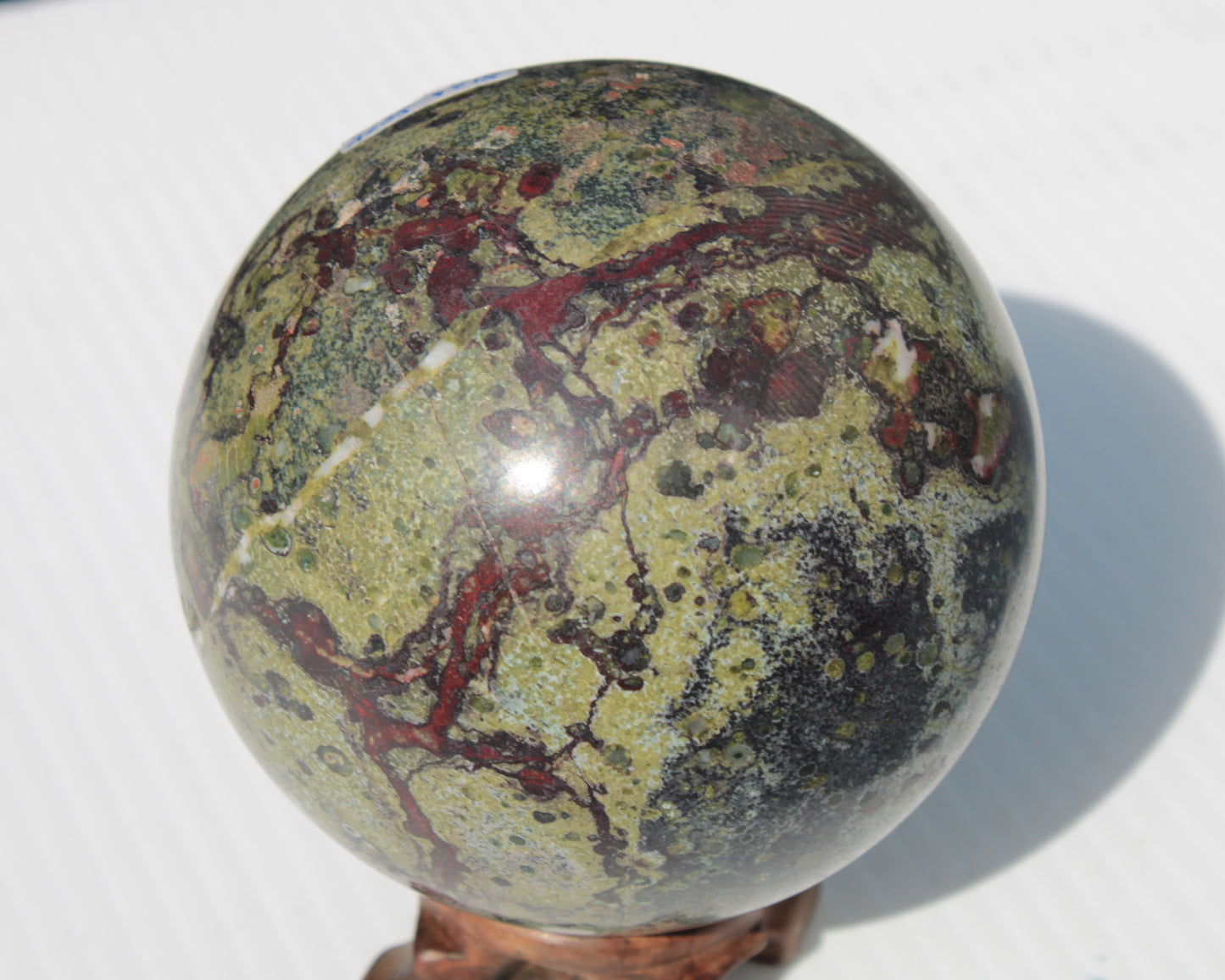 Dragons Blood Stone sphere 83mm 928g Rocks and Things