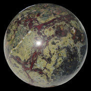 Dragons Blood Stone sphere 83mm 928g in sunlight - Rocks and Things Store