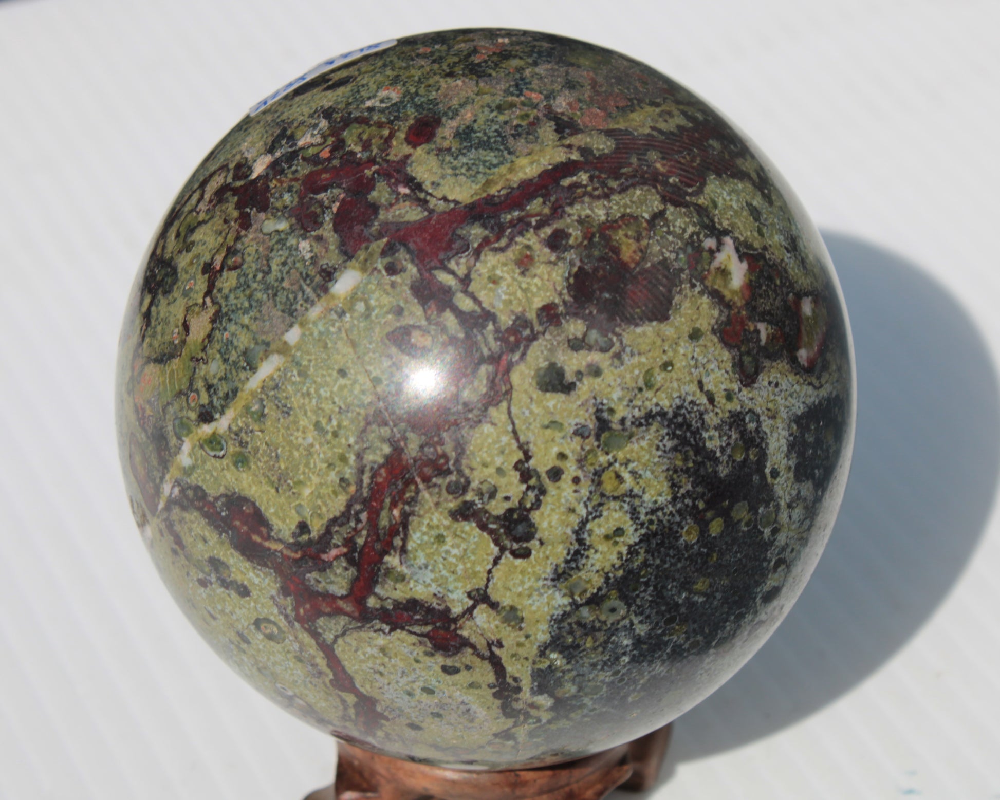 Dragons Blood Stone sphere 83mm 928g Rocks and Things