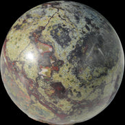 Dragons Blood Stone sphere 83mm 928g in sunlight - Rocks and Things Store