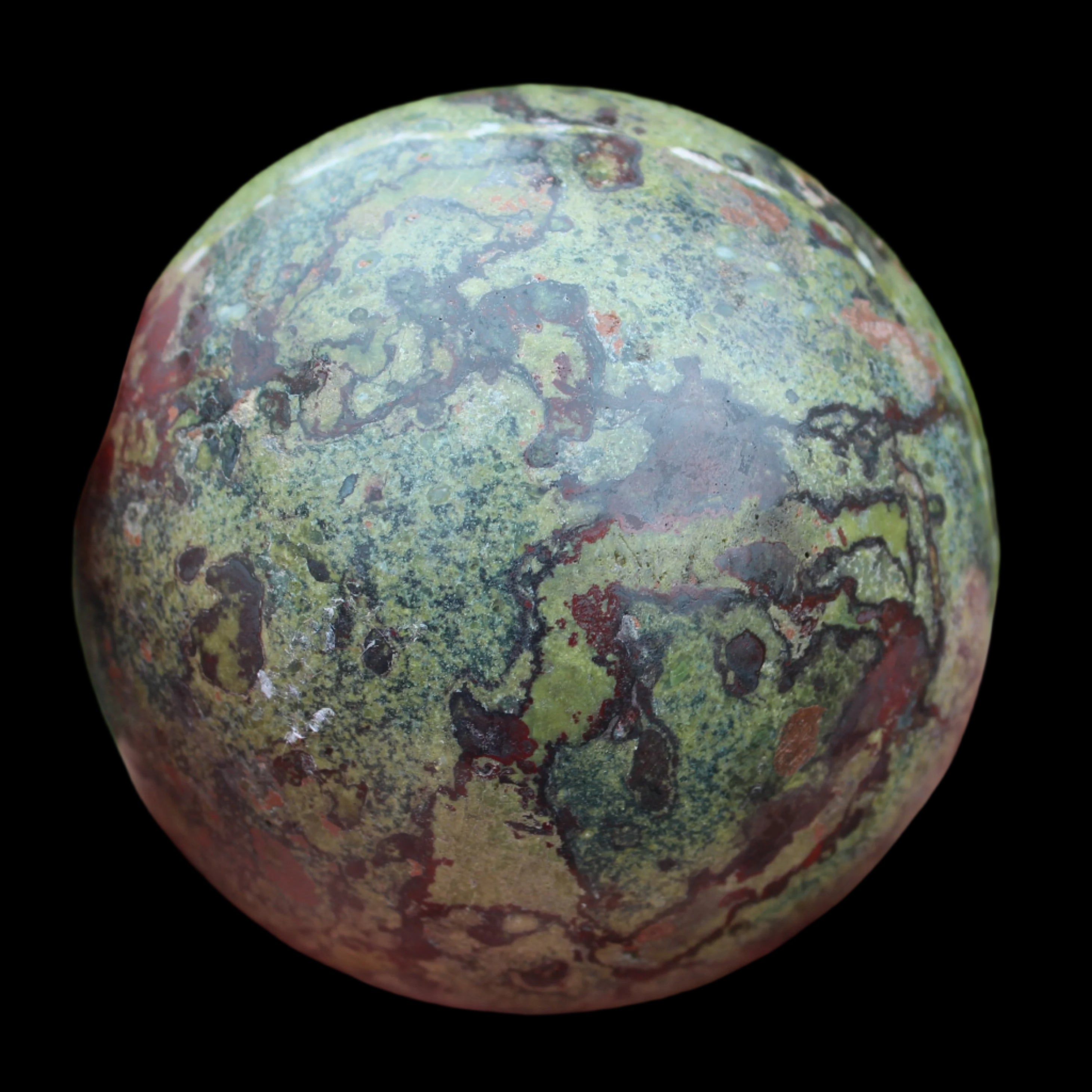 Dragons Blood Stone sphere 83mm 928g in sunlight - Rocks and Things Store