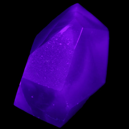 Purple Fluorite polished polygon 82g in UV light - Rocks and Things Store