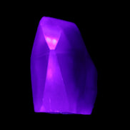 Purple Fluorite polished polygon 82g in UV light - Rocks and Things Store