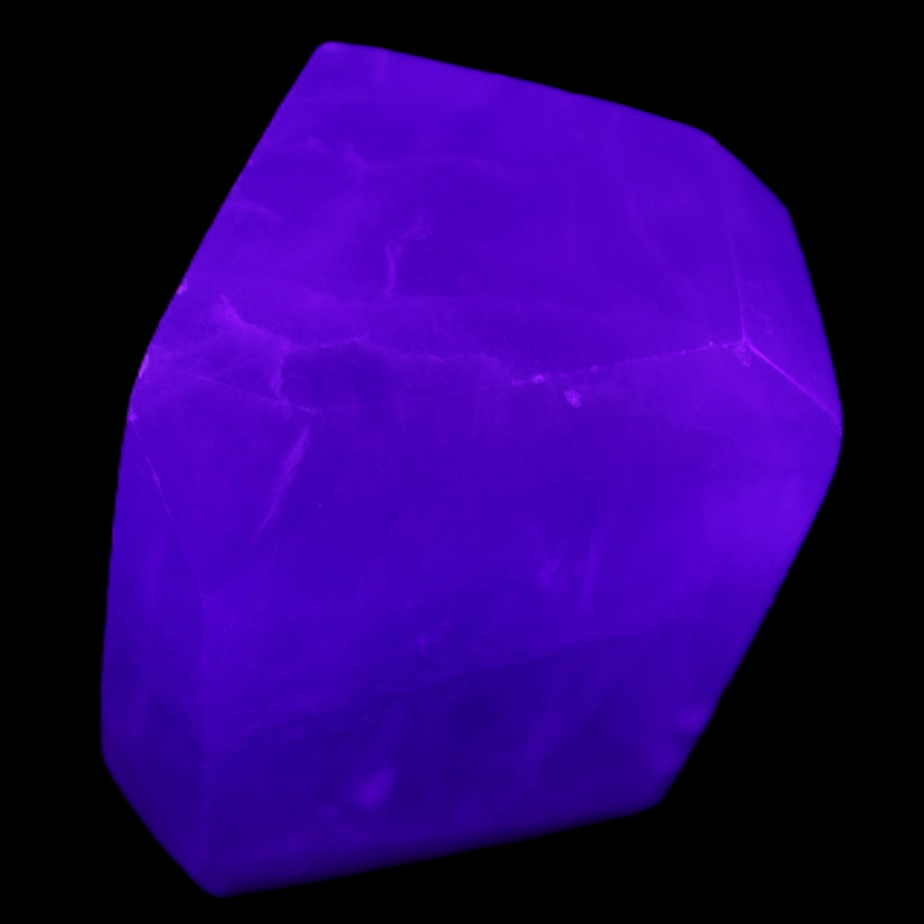 Purple Fluorite polygon 201g in UV light - Rocks and Things Store