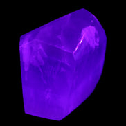 Purple Fluorite polygon 201g in UV light - Rocks and Things Store