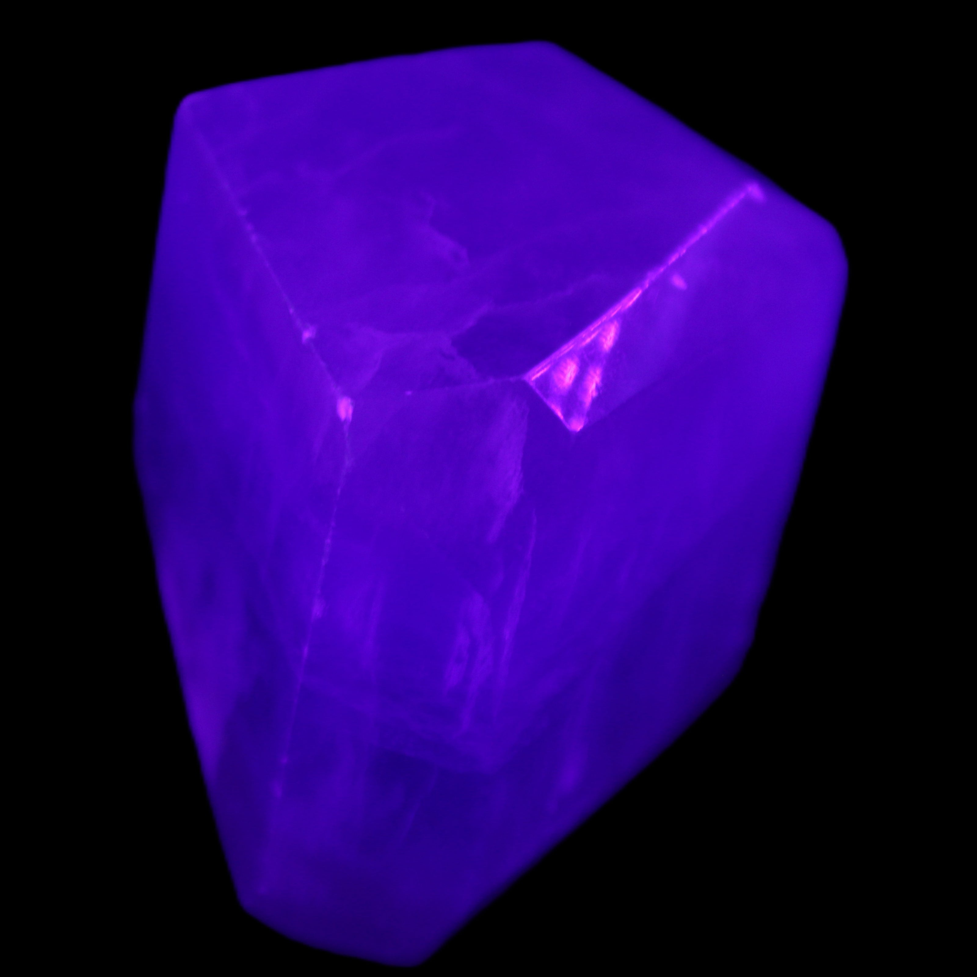 Purple Fluorite polygon 201g in UV light - Rocks and Things Store