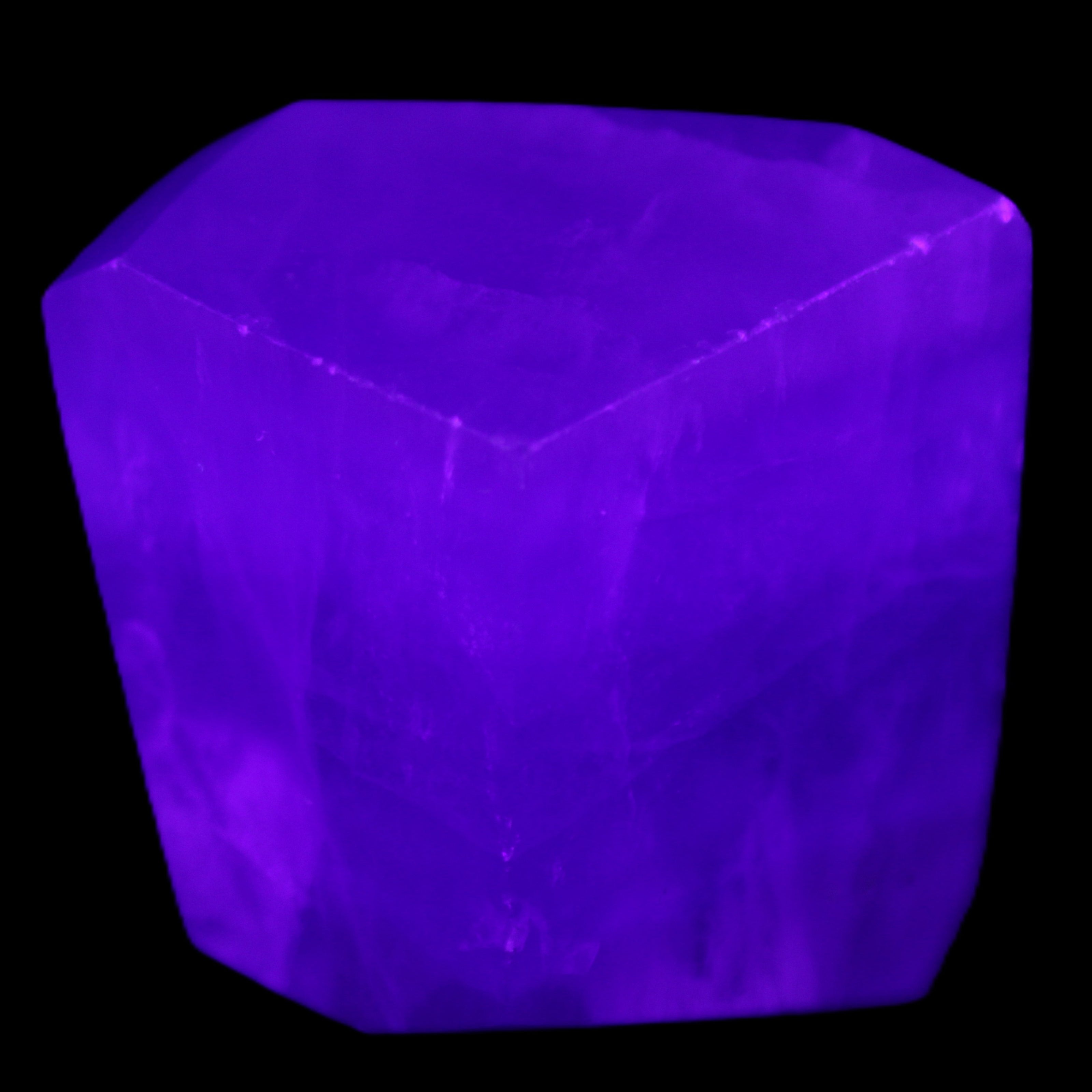 Purple Fluorite polygon 201g in UV light - Rocks and Things Store