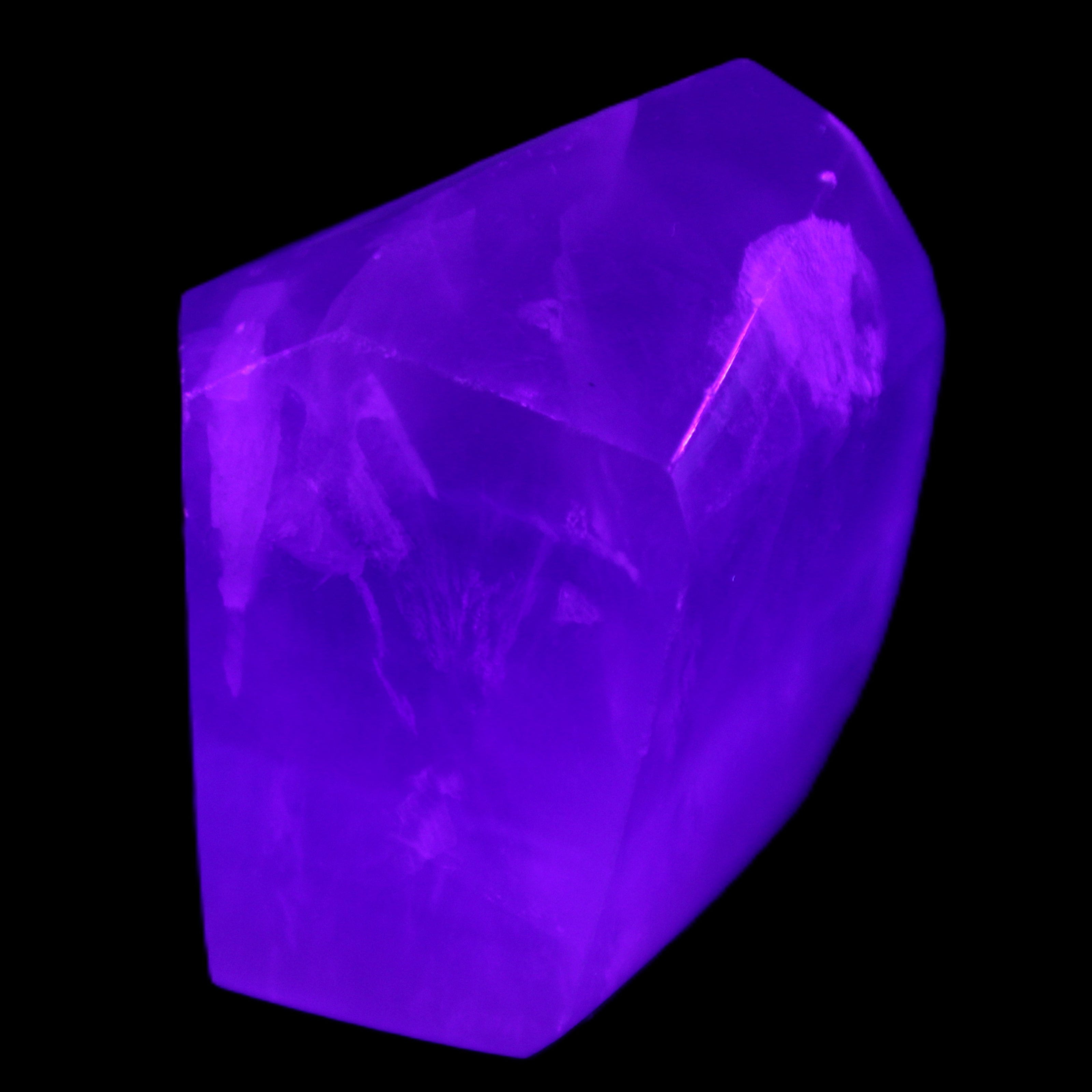 Purple Fluorite polygon 201g in UV light - Rocks and Things Store
