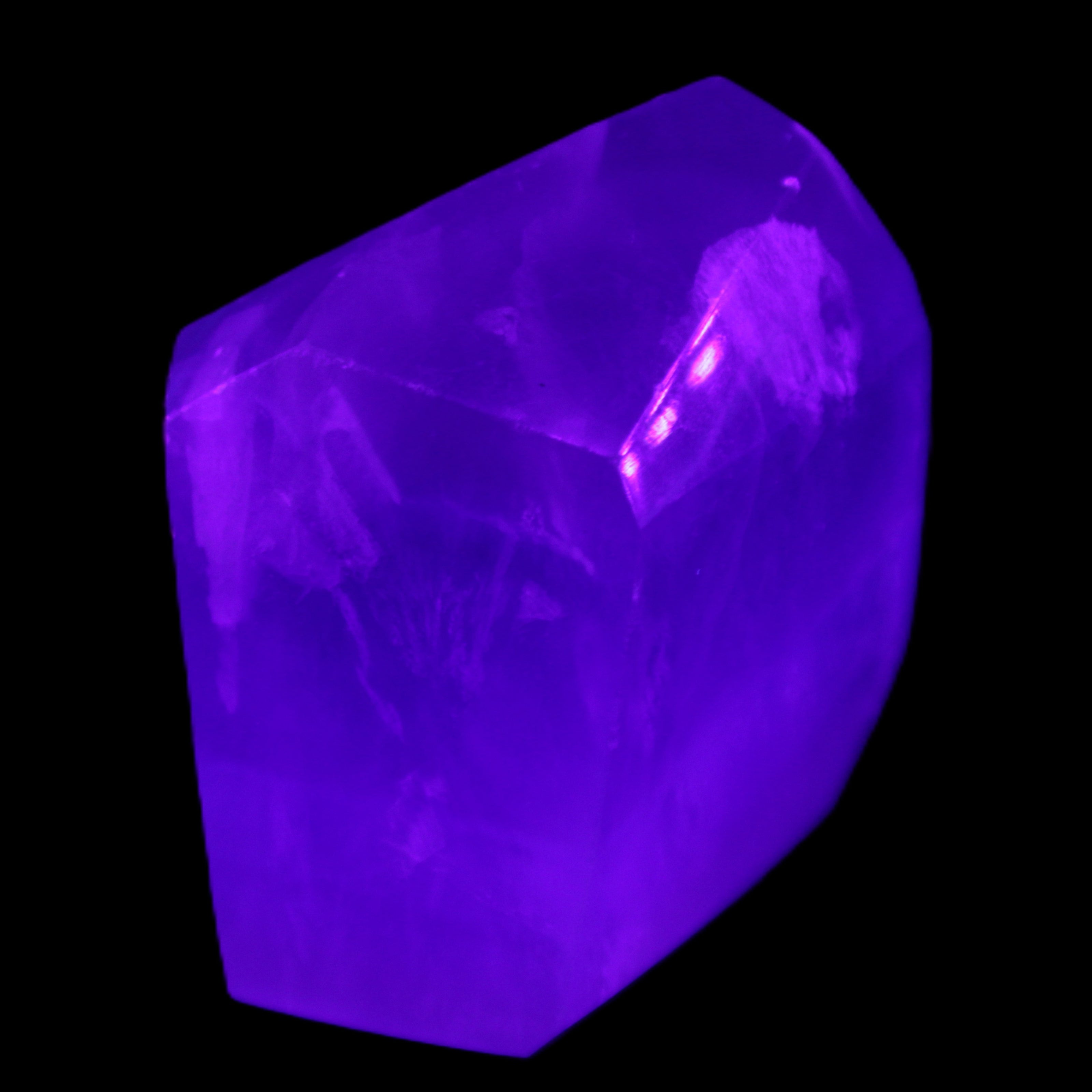 Purple Fluorite polygon 201g in UV light - Rocks and Things Store