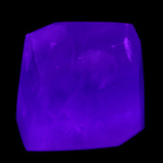 Purple Fluorite polygon 201g in UV light - Rocks and Things Store