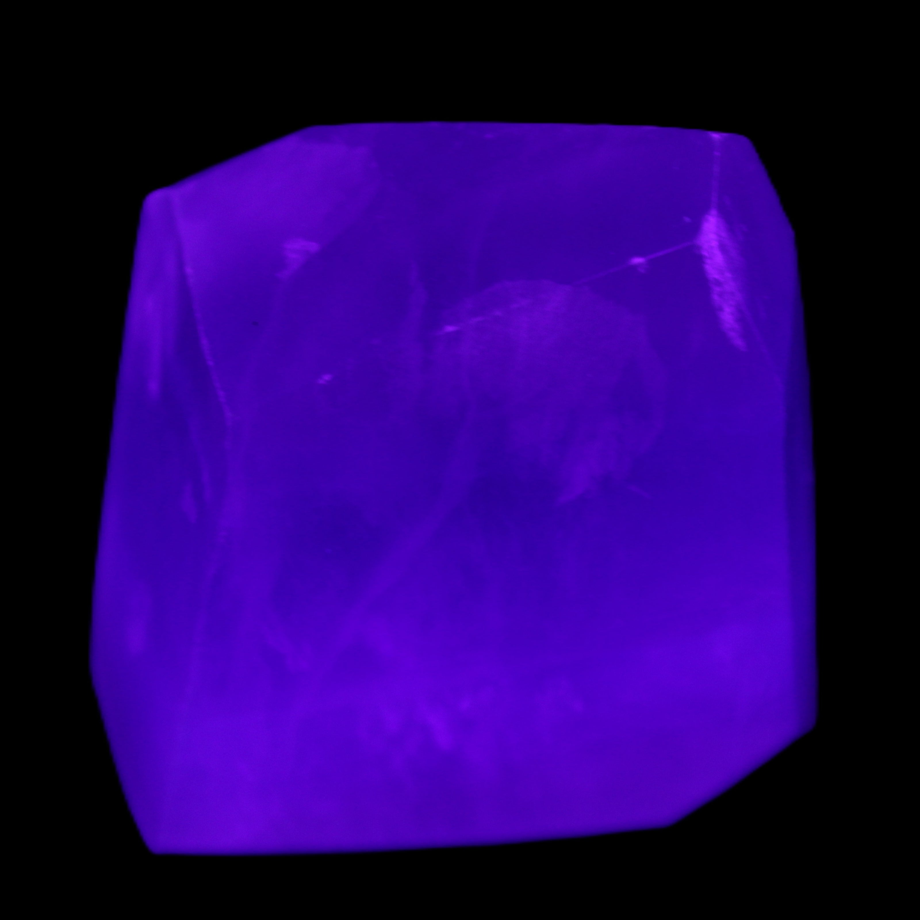 Purple Fluorite polygon 201g in UV light - Rocks and Things Store