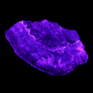 Dark Violet and Rainbow Fluorite geode section 55.9g in sunlight - Rocks and Things Store