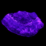 Dark Violet and Rainbow Fluorite geode section 55.9g in sunlight - Rocks and Things Store