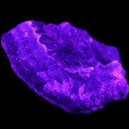 Dark Violet and Rainbow Fluorite geode section 55.9g in sunlight - Rocks and Things Store