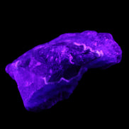 Dark Violet and Rainbow Fluorite geode section 55.9g in sunlight - Rocks and Things Store