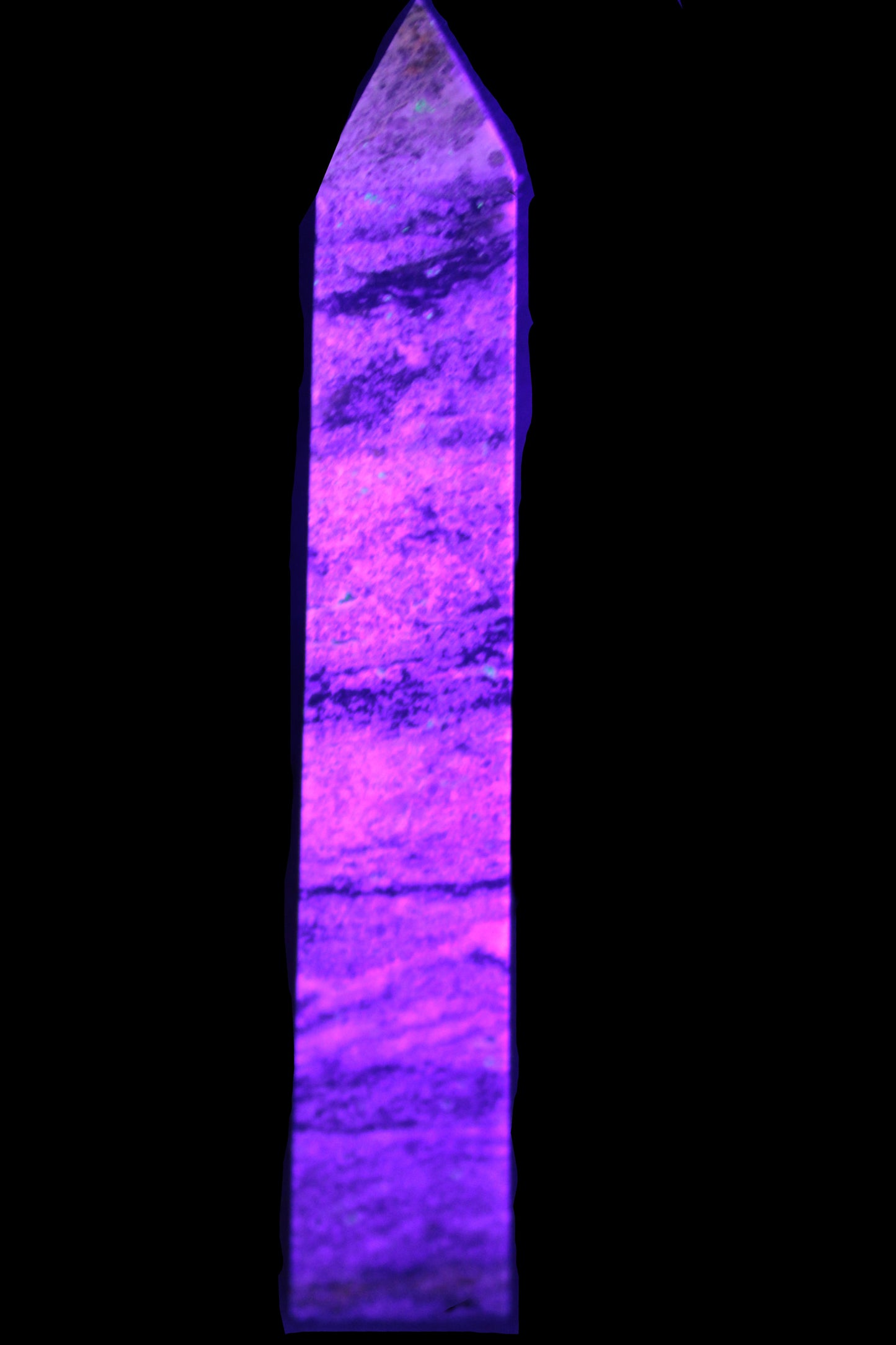 Purple Fluorite obelisk 515g in UV light