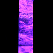 Purple Fluorite obelisk 515g in UV light