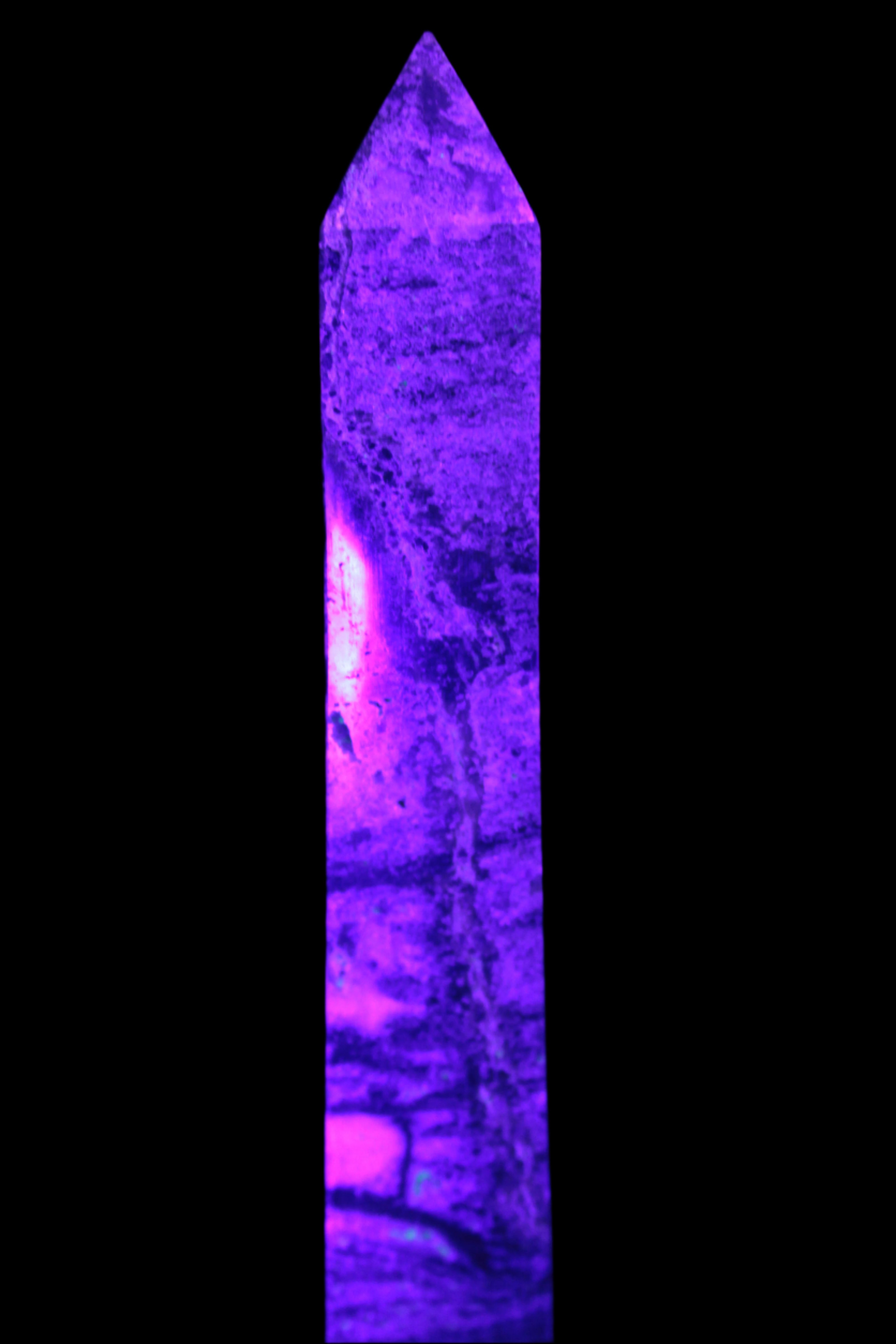 Purple Fluorite obelisk 715g in UV light - Rocks and Things Store