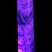 Purple Fluorite obelisk 715g in UV light - Rocks and Things Store