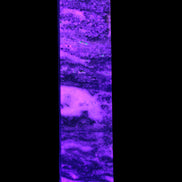 Purple Fluorite obelisk 715g in UV light - Rocks and Things Store