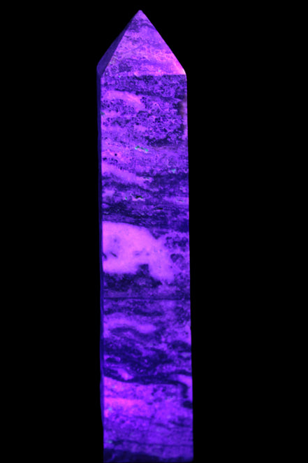 Purple Fluorite obelisk 715g in UV light - Rocks and Things Store