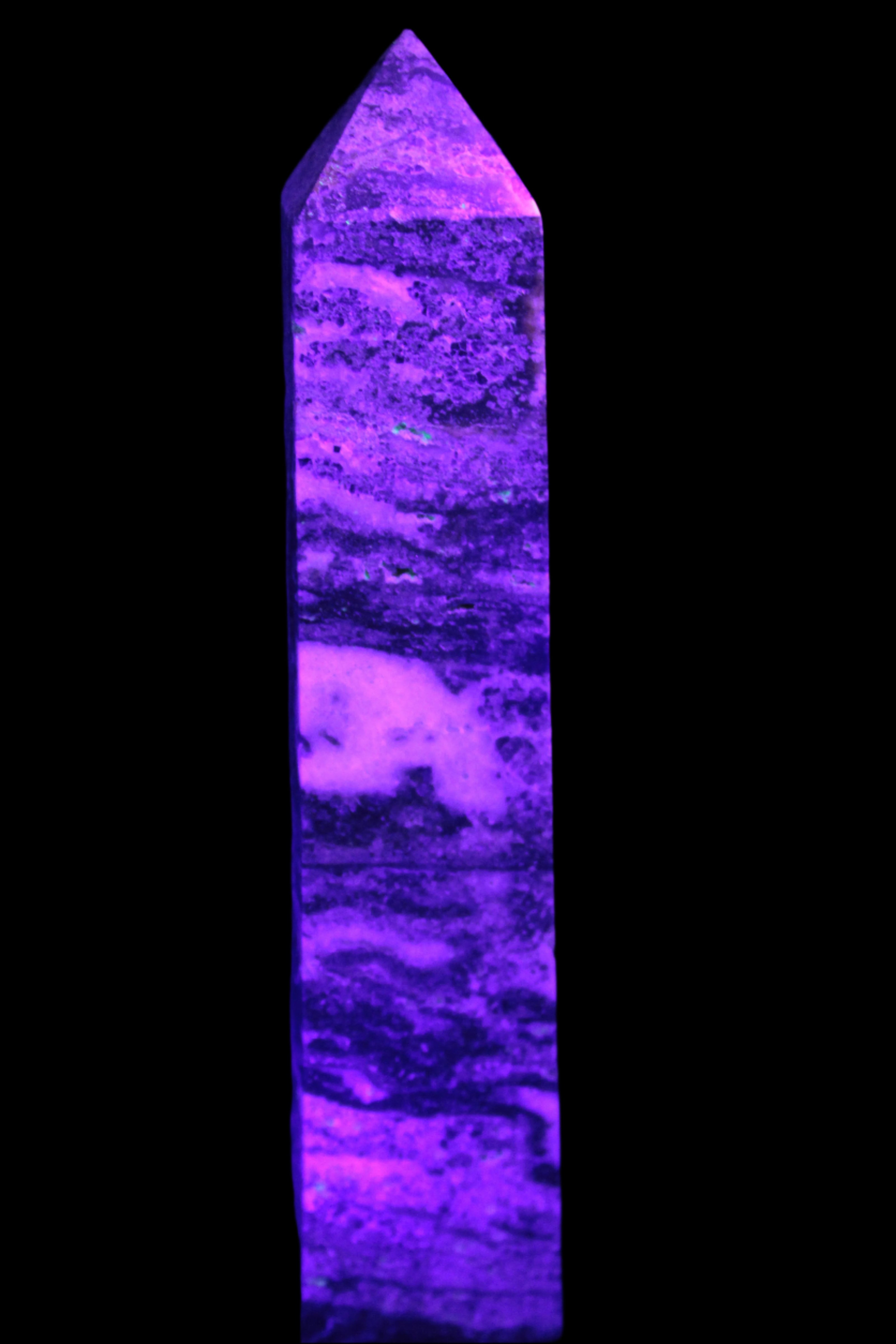 Purple Fluorite obelisk 715g in UV light - Rocks and Things Store