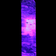 Purple Fluorite obelisk 715g in UV light - Rocks and Things Store