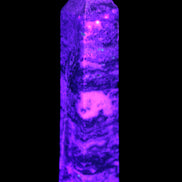 Purple Fluorite obelisk 715g in UV light - Rocks and Things Store