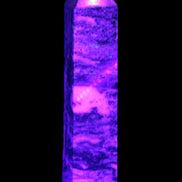 Purple Fluorite obelisk 715g in UV light - Rocks and Things Store
