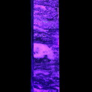 Purple Fluorite obelisk 715g in UV light - Rocks and Things Store