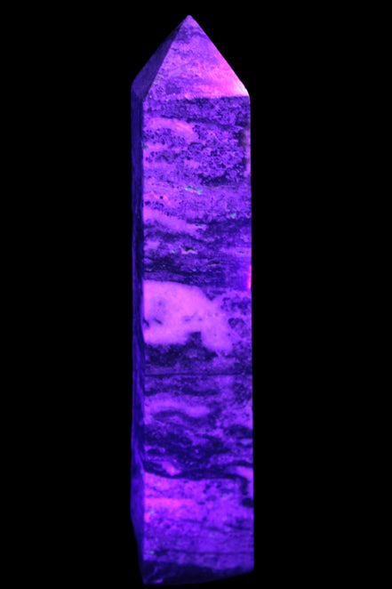 Purple Fluorite obelisk 715g in UV light - Rocks and Things Store