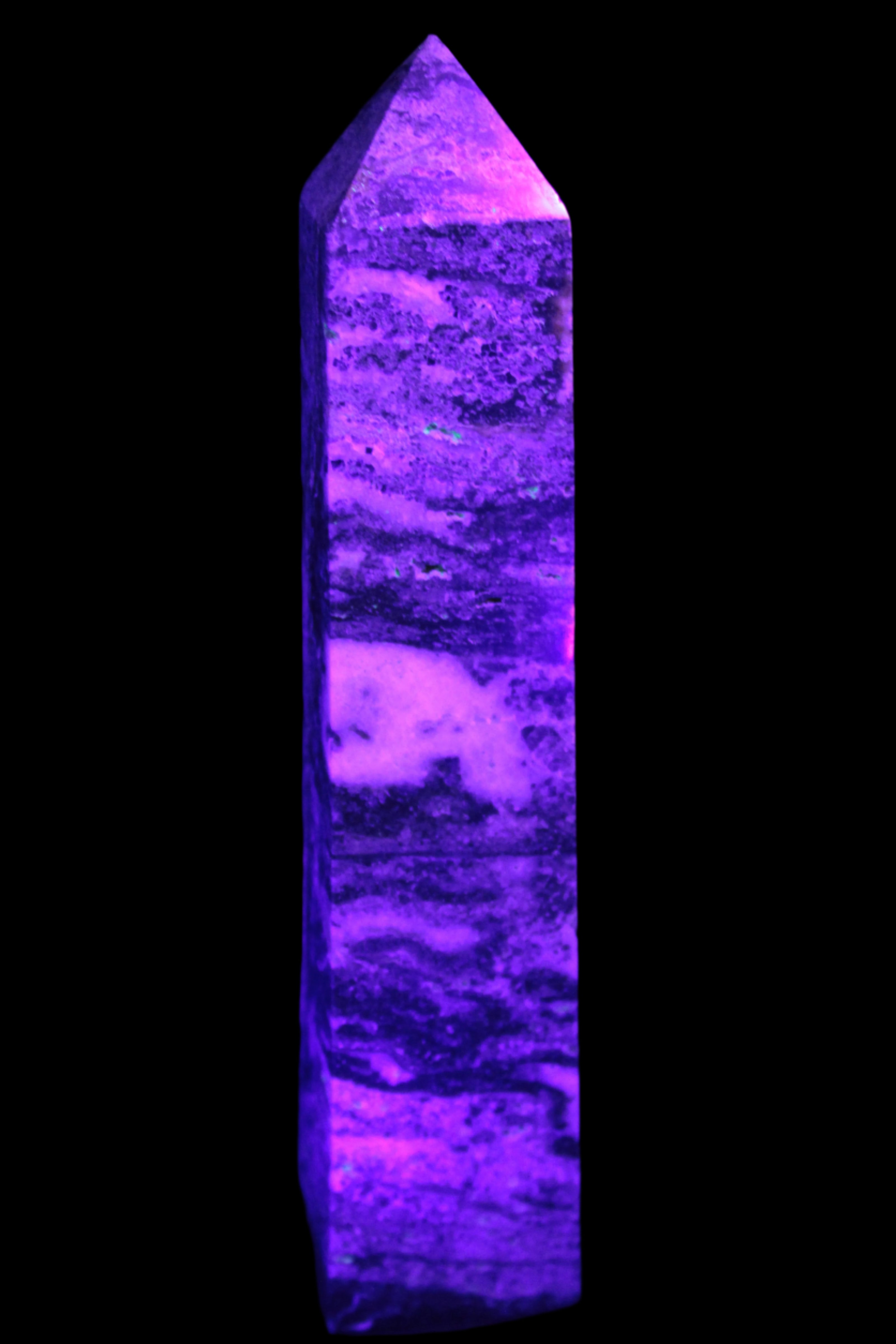 Purple Fluorite obelisk 715g in UV light - Rocks and Things Store